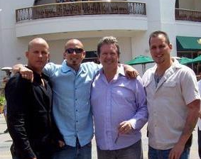Bisani, center-right, poses with his three sons.  Photo: ##http://augustobisani.org/about_us##AugustoBisani.org##