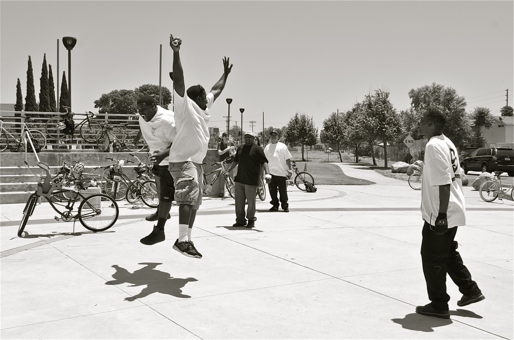 Brothers Bryan August-Jones and John Jones III (ESRBC members) jump for joy at the Watts Towers. Sahra Sulaiman/Streetsblog L.A.