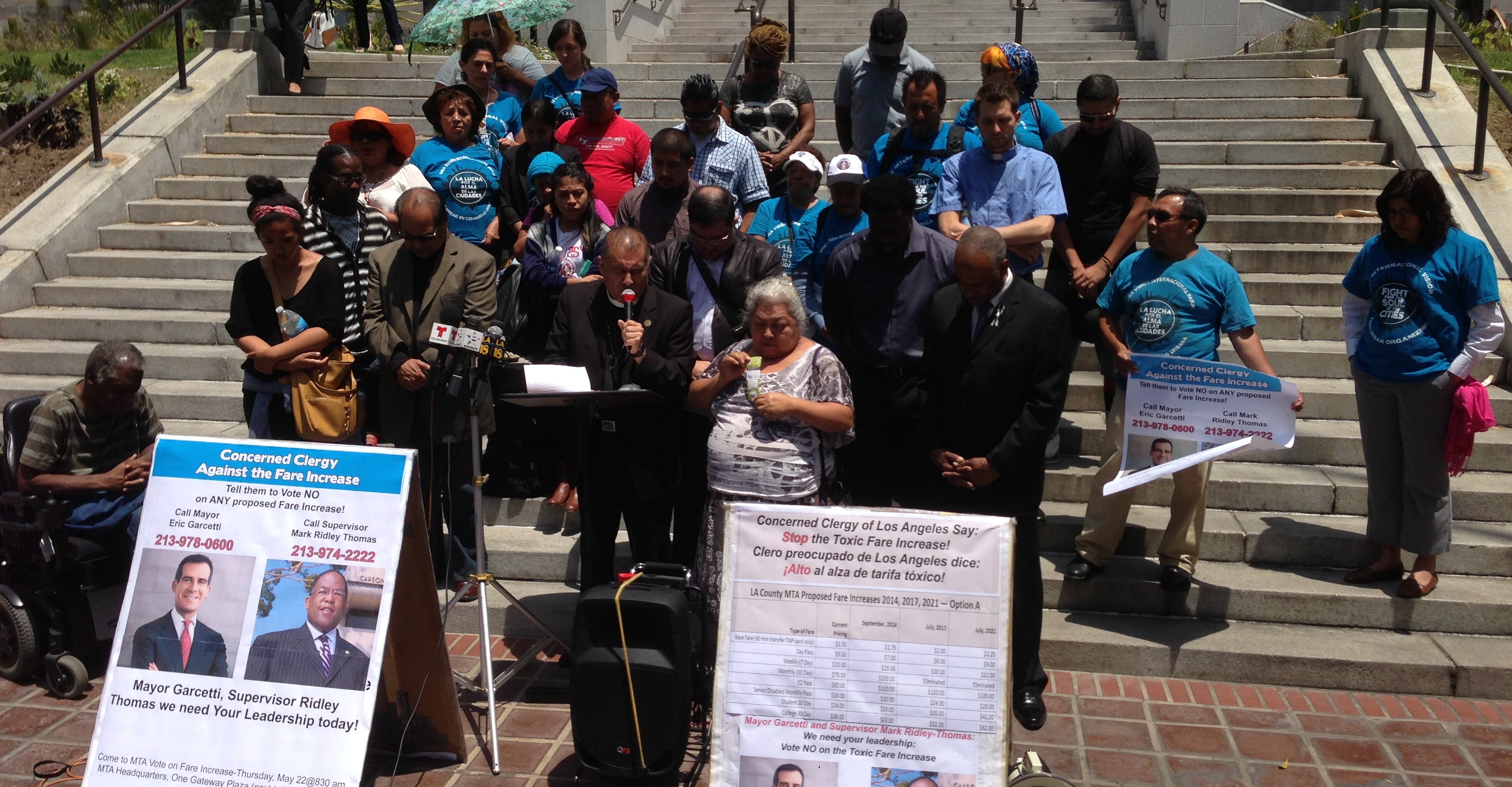 Bishop Juan Carlos Mendez, of Churches for Action, prays for Metro board officials to have hearts of compassion in opposition to Metro's proposed fare increase. Photo: Joe Linton/Streetsblog LA