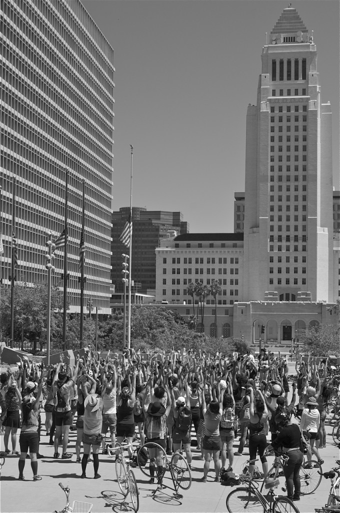 People's Yoga teachers lead a stretch session in Grand Park at the launch of Clitoral Mass. Sahra Sulaiman/Streetsblog LA