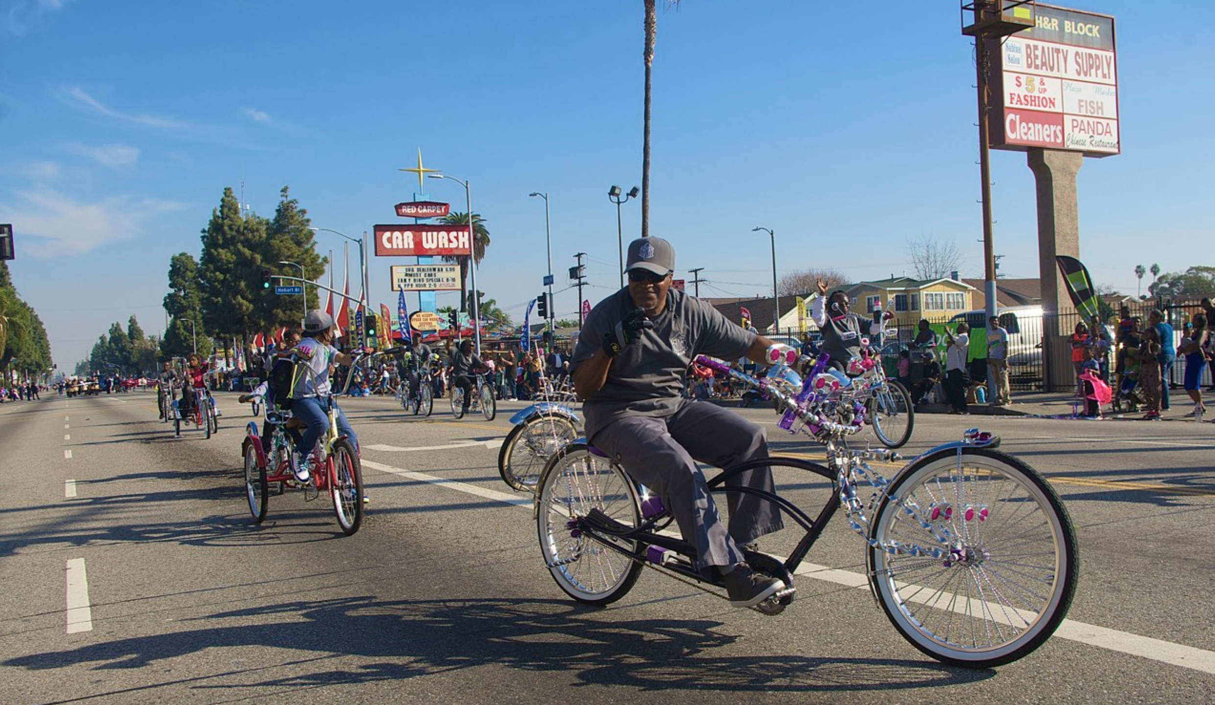 William Holloway, South L.A. Real Rydaz royalty, and the young man without a helmet on a three-wheeled bike ride up King Blvd. Sahra Sulaiman/Streetsblog L.A.