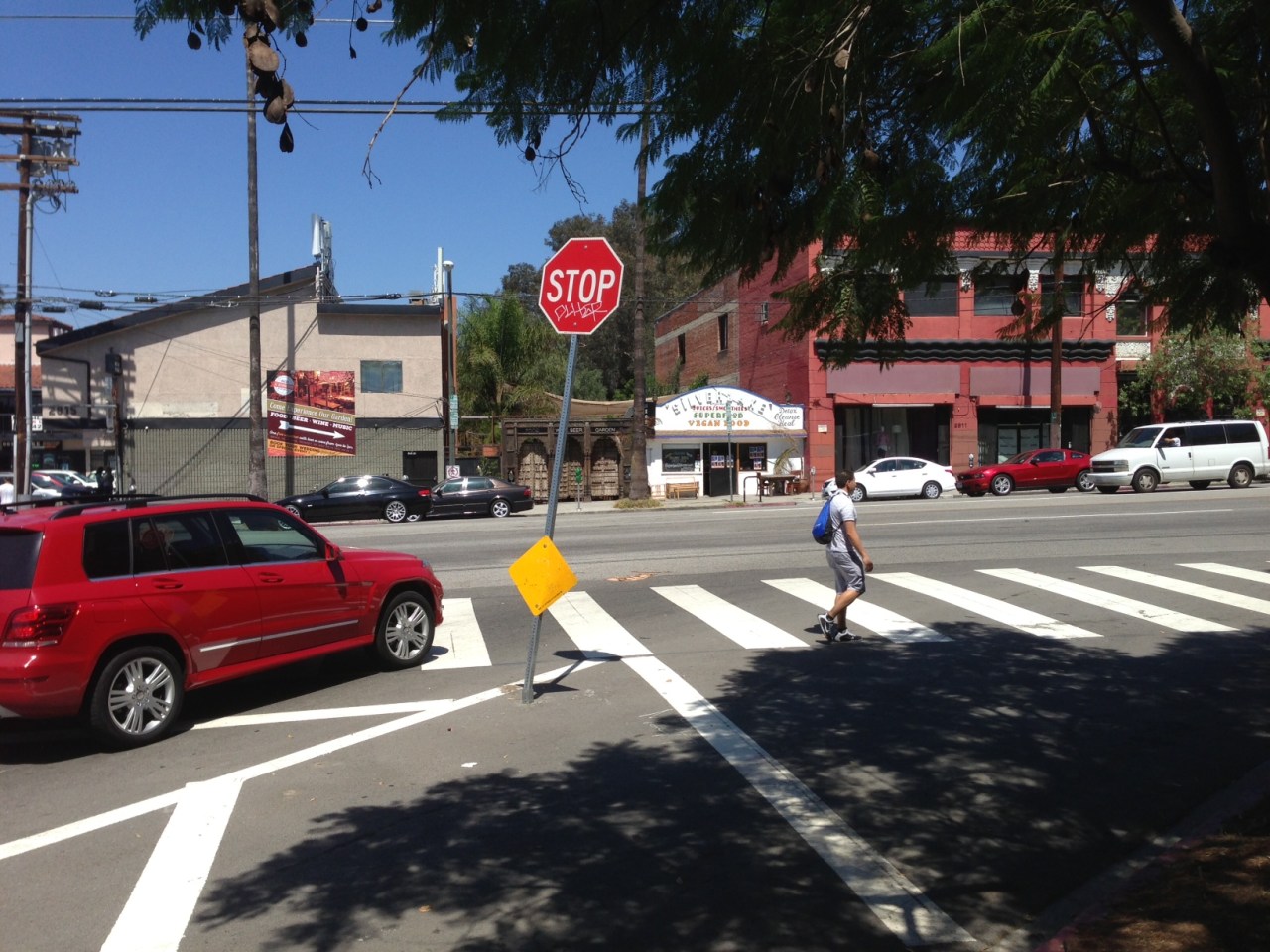 Conditions after at Sunset and Occidental. The stop sign has been moved from the sidewalk parkway out into the street.