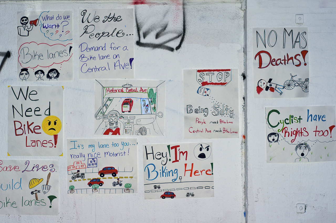Posters created by South L.A. community members adorn the walls outside of TRUST South L.A. Sahra Sulaiman/Streetsblog L.A.