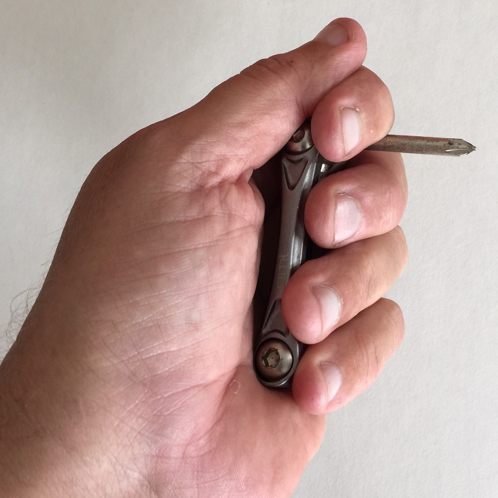 This is how the sheriff officer gestured with my small Phillips-head screwdriver