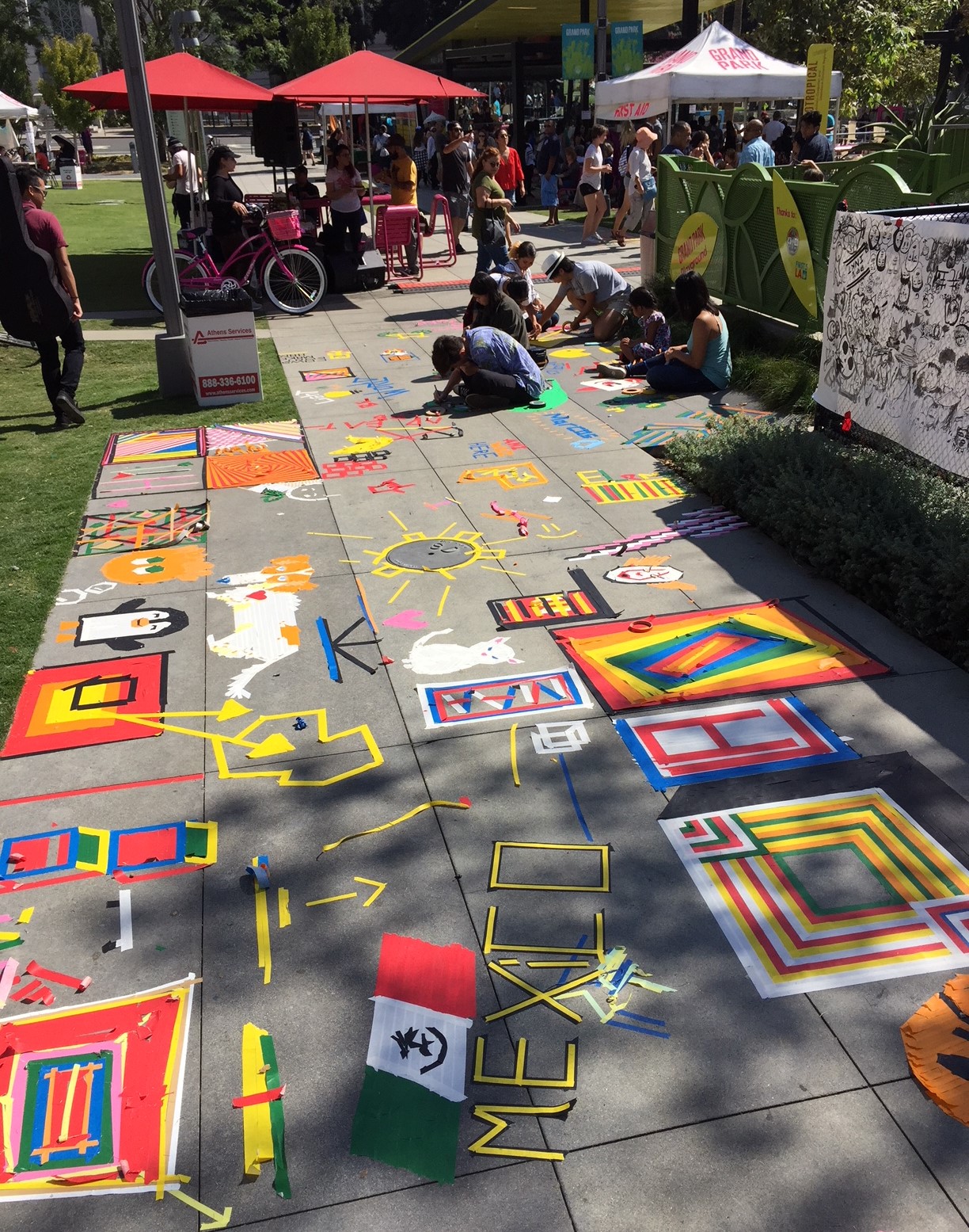 Tape art on sidewalks in Grand Park during CicLAvia
