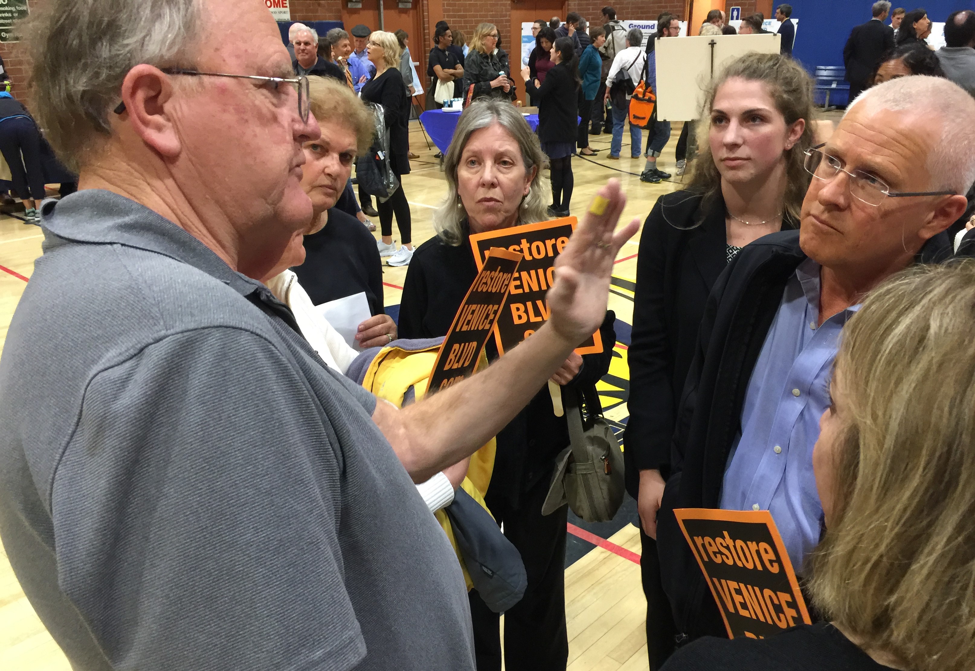 Project opponents explaining their critique to Councilmember Mike Bonin (right).