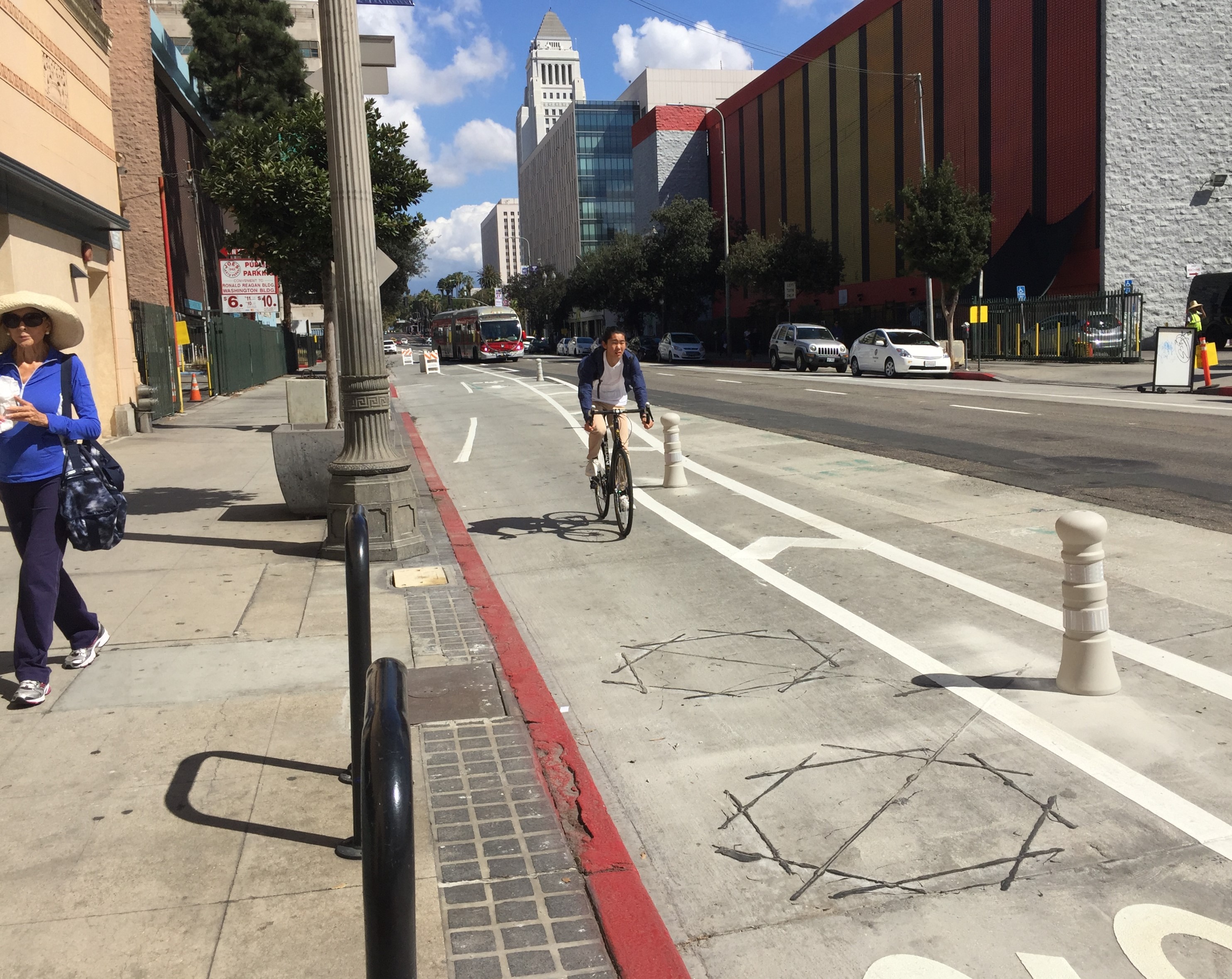 Above Third Street, the lane is on the right side of Spring