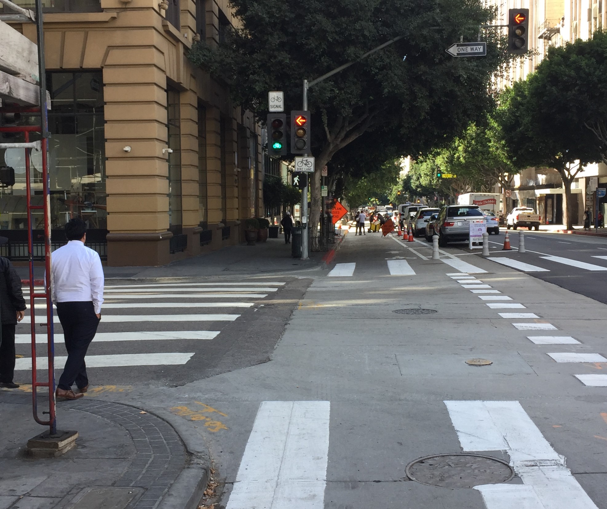 At streets with left-turning traffic (4th Street pictured) bicyclists have a signal that gives them a phase separate from left-turning cars