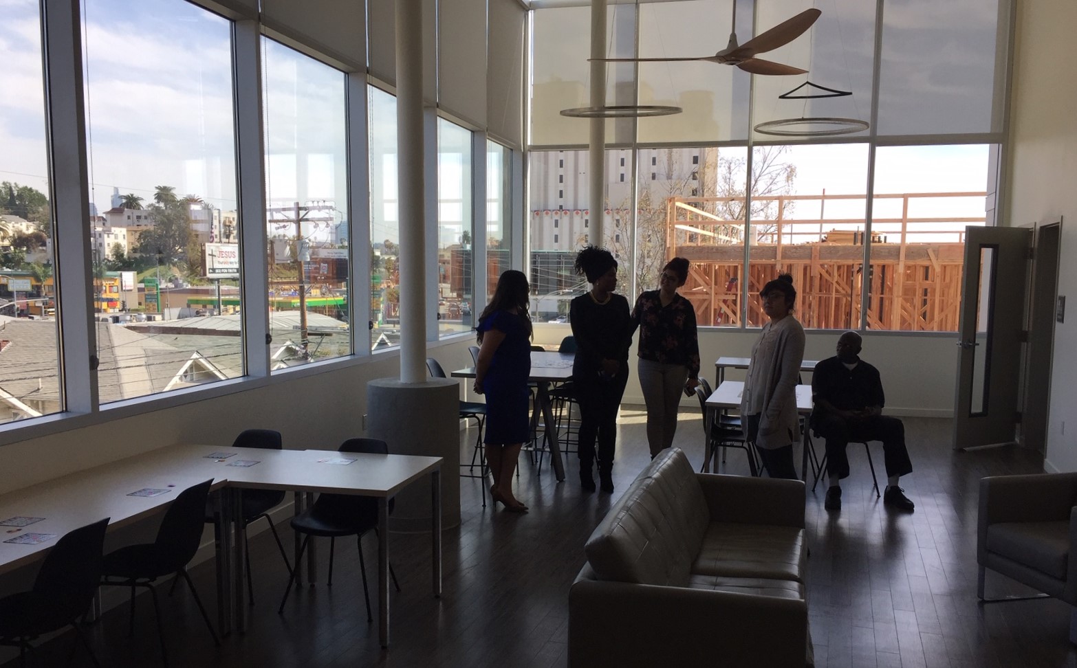 The PATH Metro Villas community room includes television, lounge, and kitchen