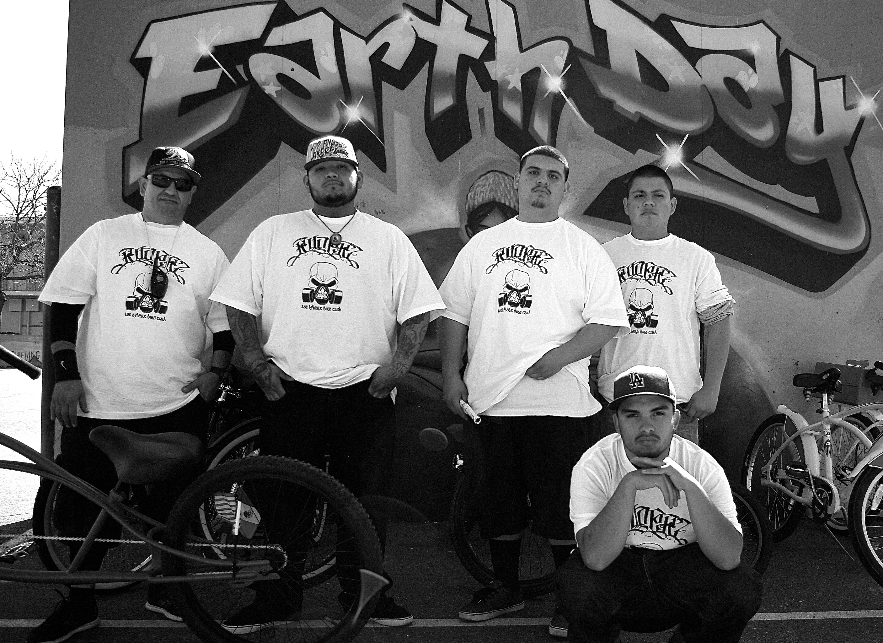 J.P., at left, with some of the members of Los Ryderz during a ride pit-stop at Normandie Elementary in 2013. Sahra Sulaiman/Streetsblog L.A.