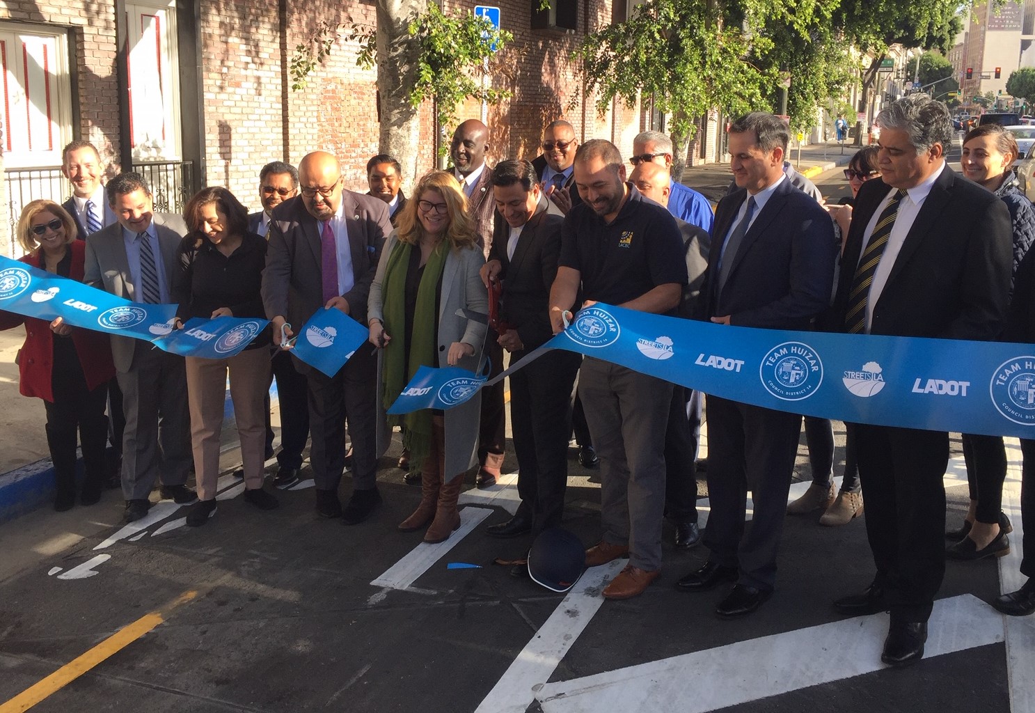 Cutting the ceremonial ribbon on the Main Street bikeway