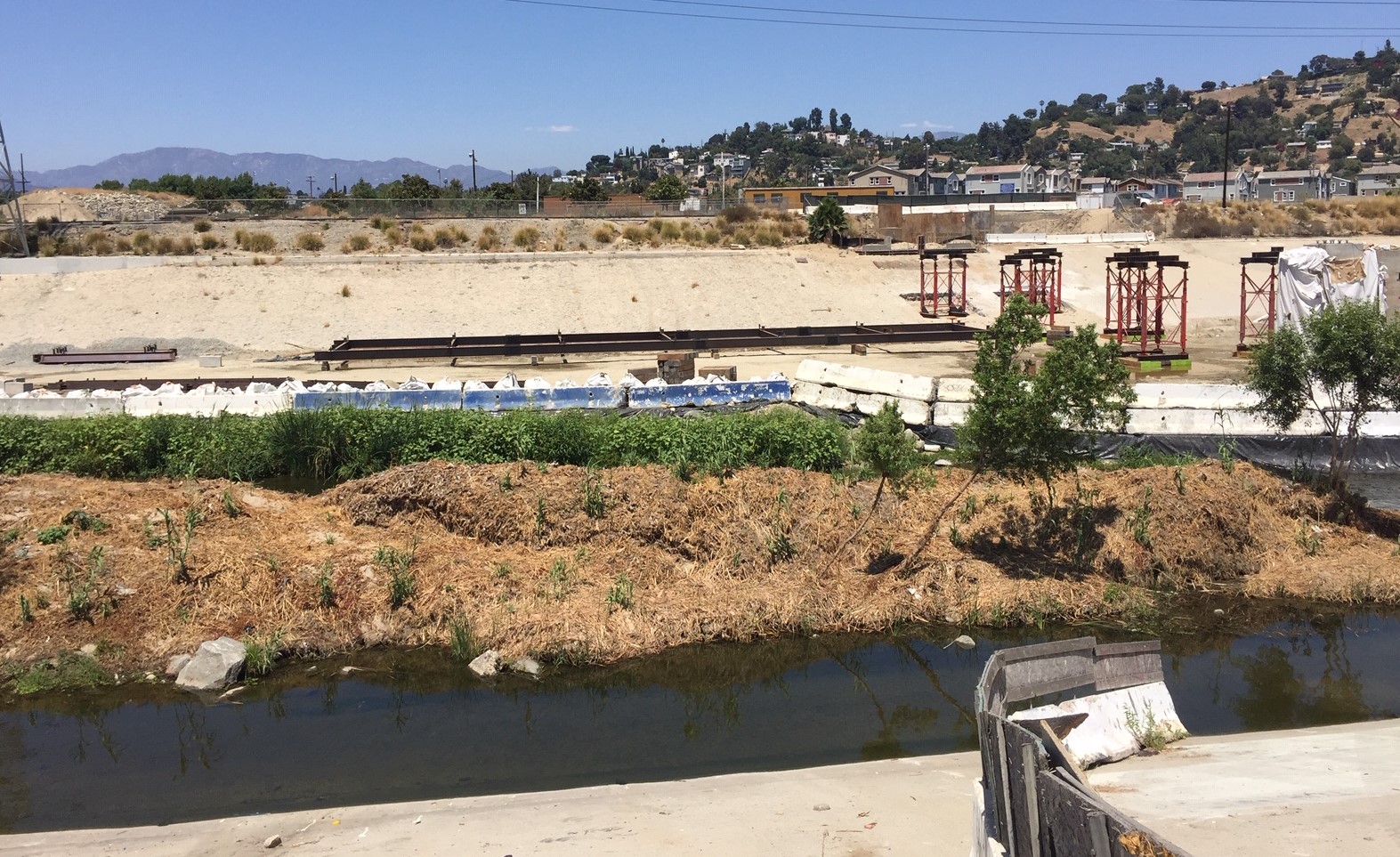 Long metal structure appears to be part of the bridge's central span