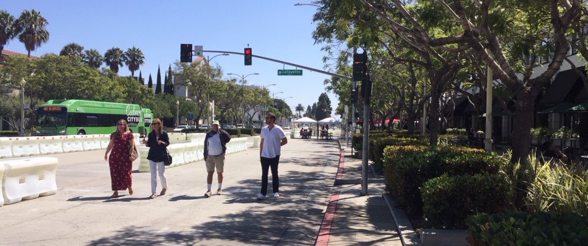 In areas where outdoor dining is not using barricaded street space, pedestrians are using it
