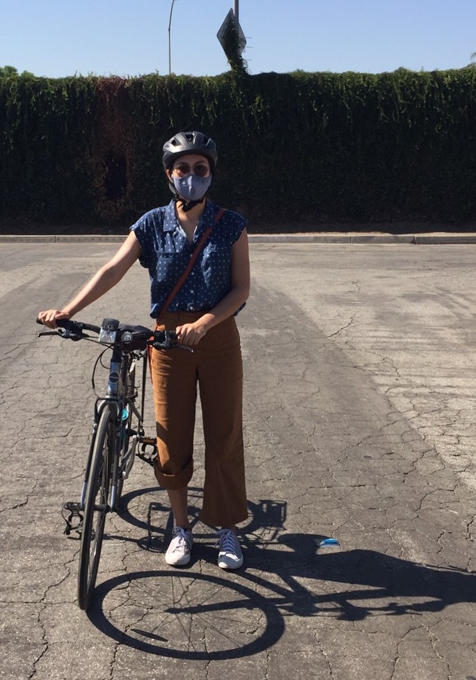 Alexandria Contreras. Behind her is the 5 Freeway soundwall, down the street from where she grew up.