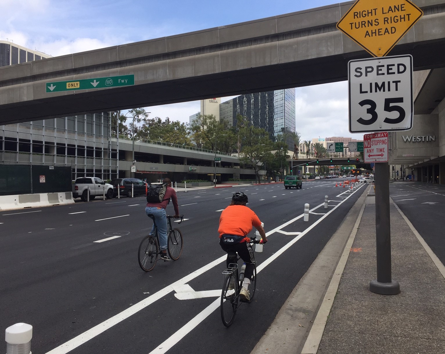Sometimes one narrow lane isn't enough for two cyclists riding togehter