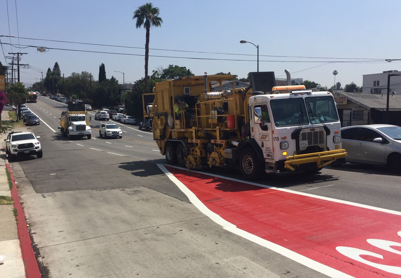 Contractor truck scraping existing pavement markings this morning