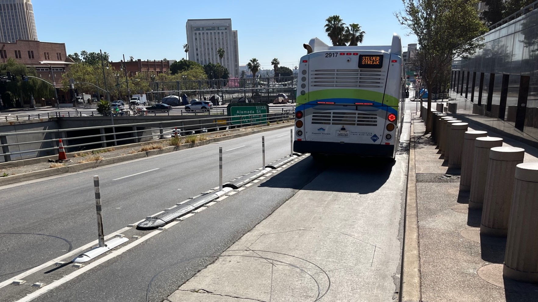 Bus lane protection soft-hit posts on Aliso Street between Main and Spring Streets