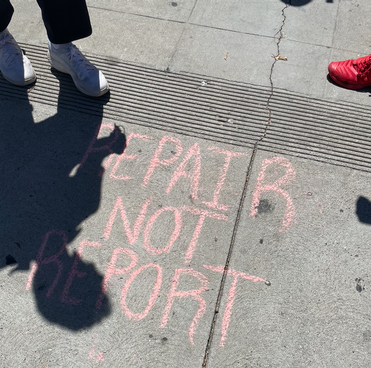 Chalk markings were underfoot near where mechanics wrenched and advocates talked to the media. Photo: Damien Newton