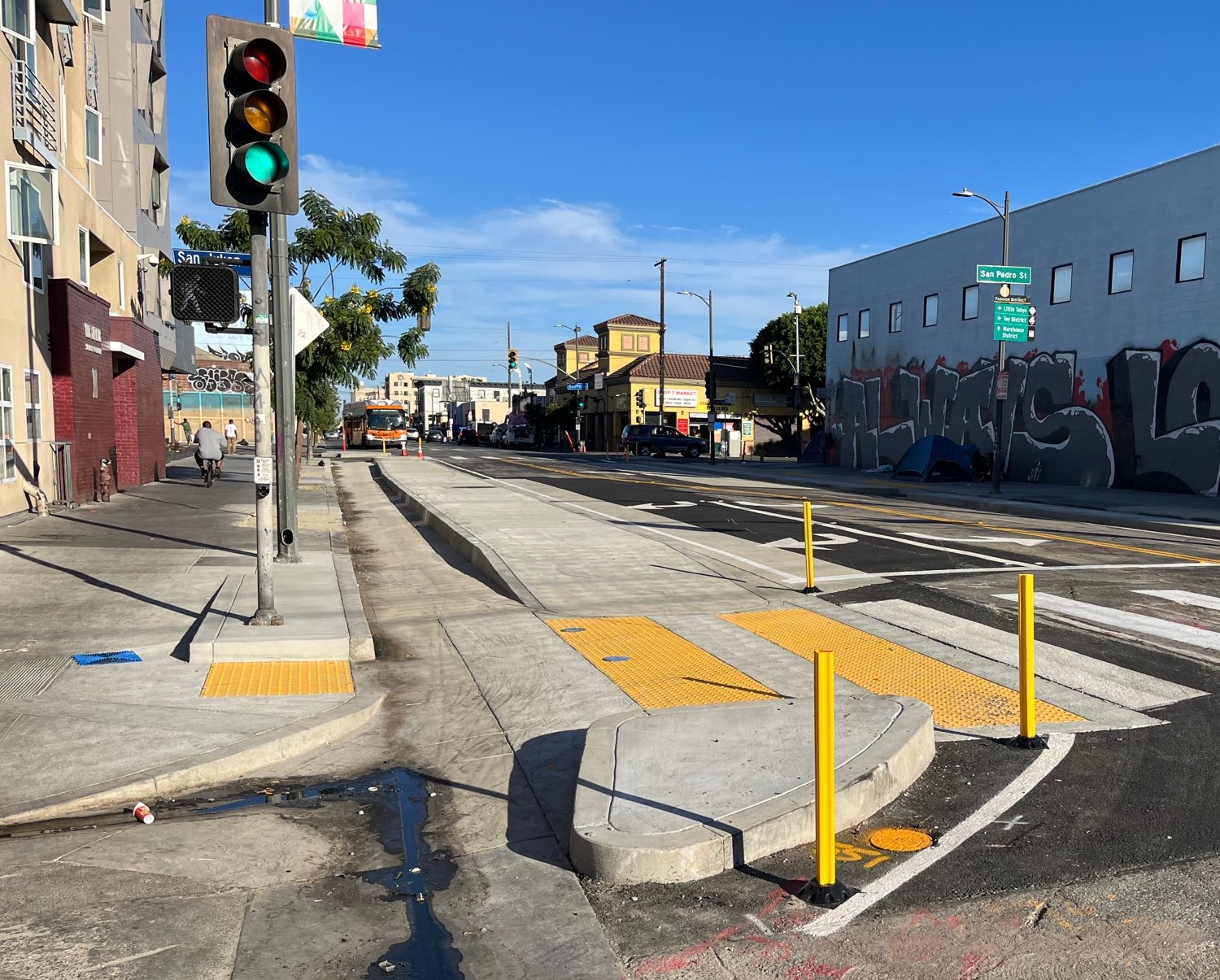 7th Street Streetscape concrete curb-protected bikeway under construction