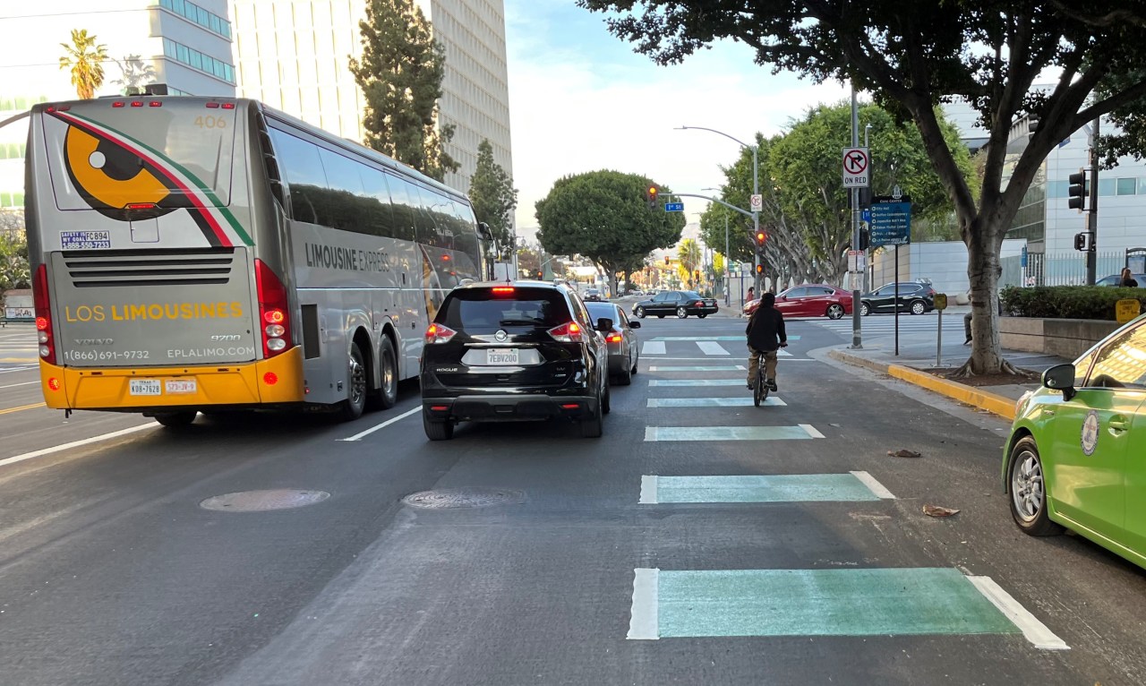 The Los Angeles Street lanes feature green pavement at conflict zones