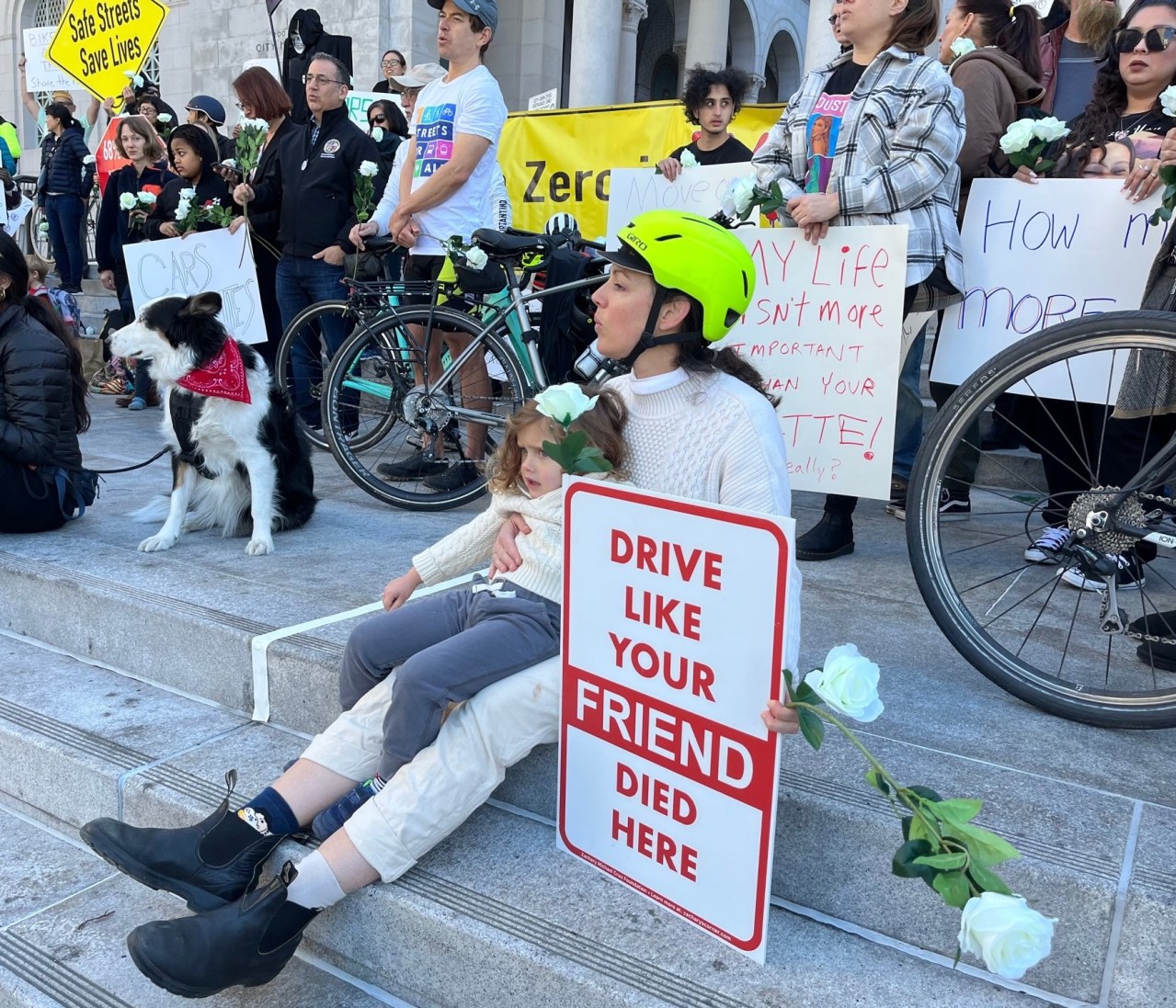 Protestor holds sign reading